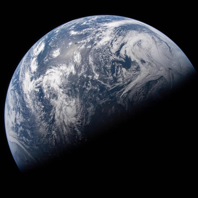 Earth is illuminated against the blackness of space in this photo taken by an Artemis II crew member through an Orion spacecraft window on the second day of the mission. Credit: NASA