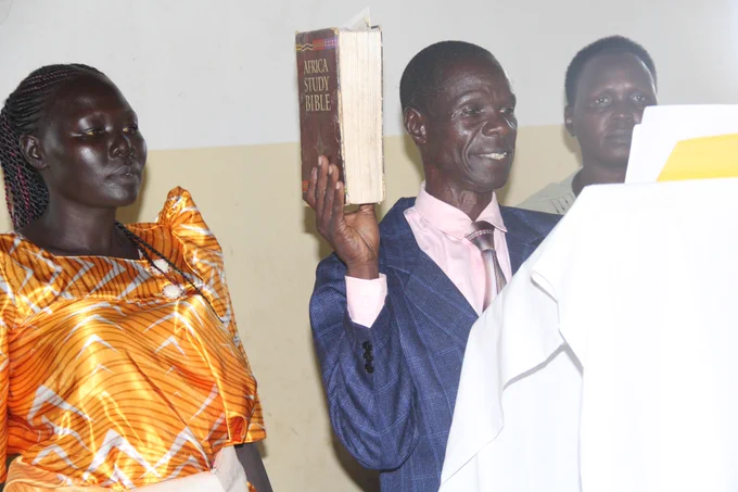 Mr. Opio Moses is taking the oath as the Chairperson of Teboke Sub County.