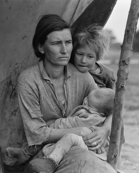 An image in the same series as Dorothea Lange's famous "Migrant Mother" photograph features the same mother holding a baby, but with another small child leaning on her left shoulder, face turned toward the camera.