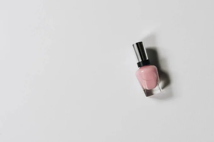 Photo of one bottle of pink nail polish. 
