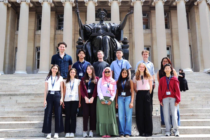 the 2026 SRP Interns pose in front of the Alma Mater statue at Columbia University