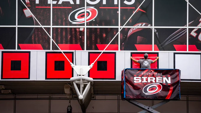 Photo of the tenth warning flag being placed outside the Lenovo Center
