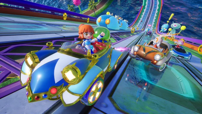 Arle racing in the Twinkle Bayoen machine on the Chao Park course. Cream, Amy, Zazz, Knuckles, and Dr. Eggman dollow behind.