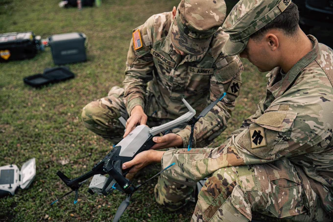 Two Oklahoma National Guardsmen replace a drone\u2019s battery during Exercise Lightning Strike at Camp Gruber Training Center, Oklahoma, April 15, 2026. The Oklahoma National Guard, in partnership with Oklahoma Office of Emergency Management, hosted Exercise Lightning Strike, a domestic exercise scenario of an EF5 tornado. At the center of the exercise is the integration of uncrewed aircraft systems (UAS) across various scenarios, enabling real-time data sharing, improved situational awareness and more effective coordination among participating agencies. Exercise Lightning Strike brings together a wide range of agencies to operate within a shared framework, reinforcing the Guard\u2019s role in supporting civil authorities during domestic incidents and natural disasters. (Oklahoma National Guard photo by Sgt. Anthony Ackah-Mensah)