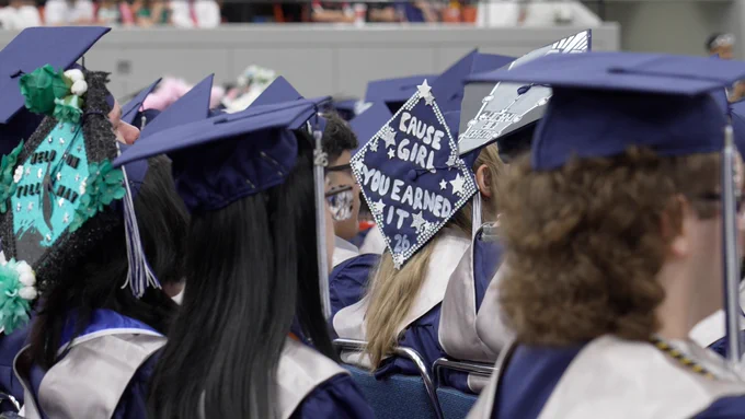 A graduation cap says "cause girl, you earned it."