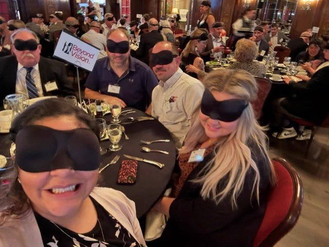 Robert, Dave, Molly and Dee wearing their blindfolds and taking a selfie together at Dining in the Dark.