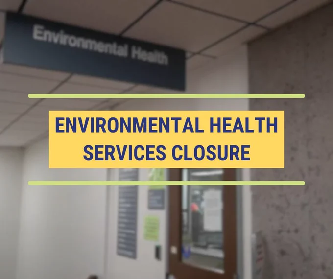 Sign about Environmental Health Services closure with a blurred image of the front desk that will be closed in the background.