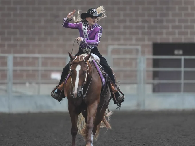 One of the Cowgirl Queen entries riding in the Jacobson Arena. 