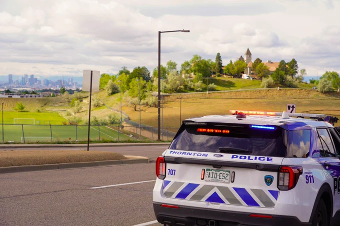 Thornton patrol car and the Denver skyline