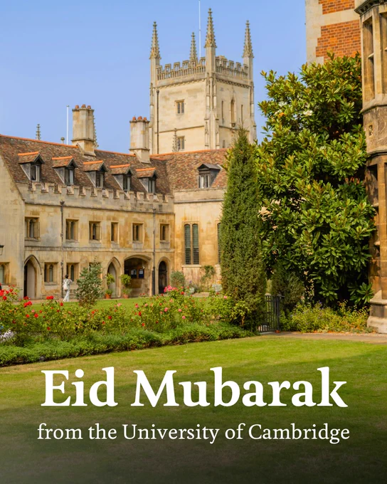 A historic building with Gothic architecture in Cambridge is surrounded by a garden with lush greenery and blooming flowers. Text reads, "Eid Mubarak from the University of Cambridge".
