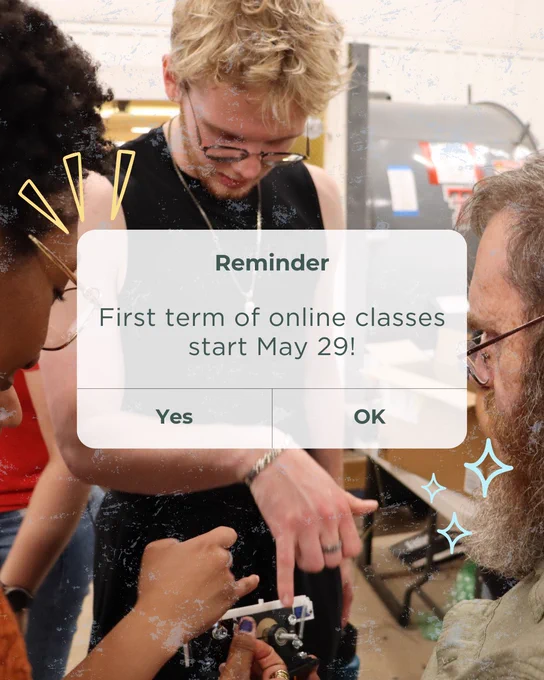Photo of students collaborating in a classroom or lab setting while examining a small device. An overlay styled like a phone notification reads: “Reminder — First term of online classes start May 29!” with “Yes” and “OK” buttons below. Decorative graphic elements surround the image.