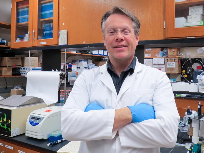 Larry Millet standing in a lab