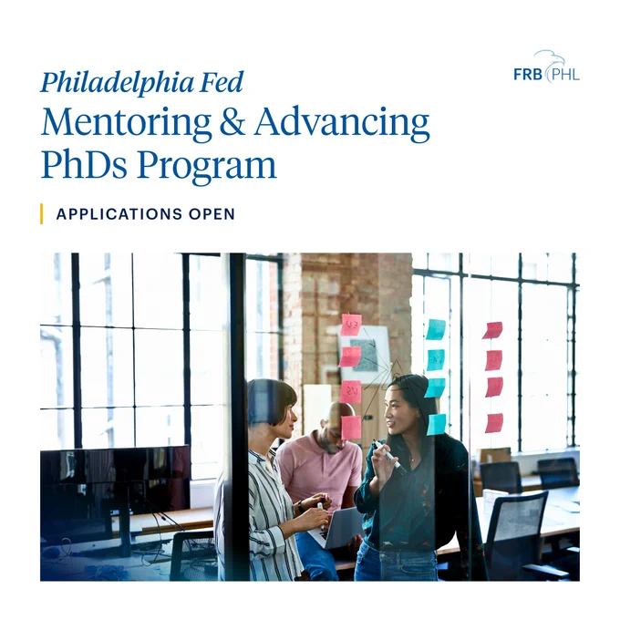 The image features two individuals in a modern office setting, engaged in conversation. A glass wall behind them is adorned with colorful sticky notes. Text reads, "Philadelphia Fed Mentoring & Advancing PhDs Program - Applications Open." The FRB PHL logo is visible in the top right corner.