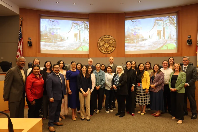 A group photo of Council with planning academy graduates