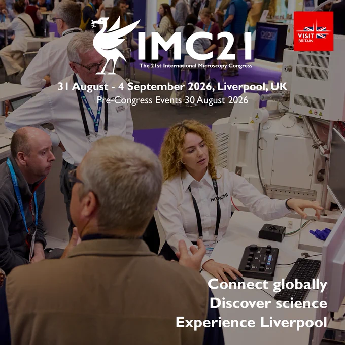 Scientists and attendees engaging at a microscopy conference booth with advanced equipment in Liverpool, 2026.
