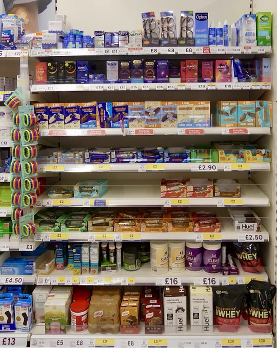 Supermarket shelves stacked with food supplements and other 'health-related' products.