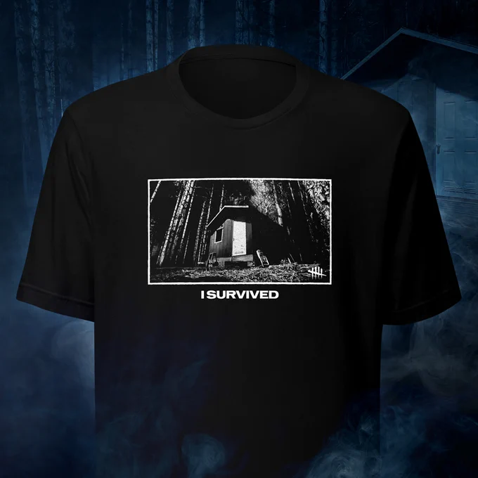  'I SURVIVED' T-shirt on dark cabinet background from the live stream.
