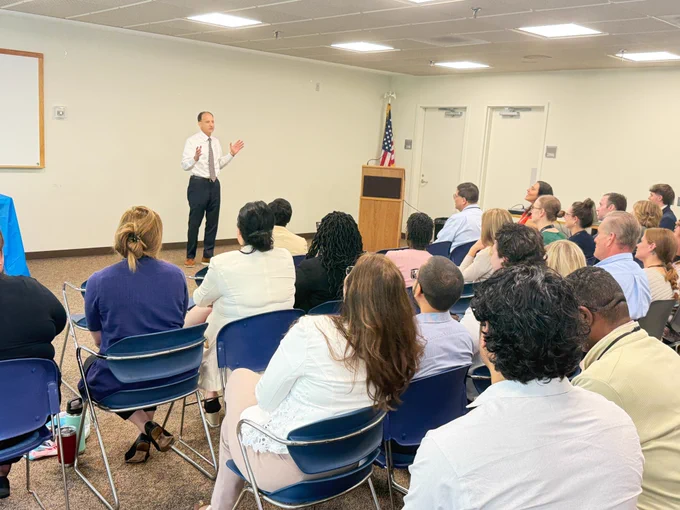 Photo: Medicaid Fraud Division Director Josh Lichtblau talks to OSC staff at an event celebrating his career at the New Jersey Office of the State Comptroller.