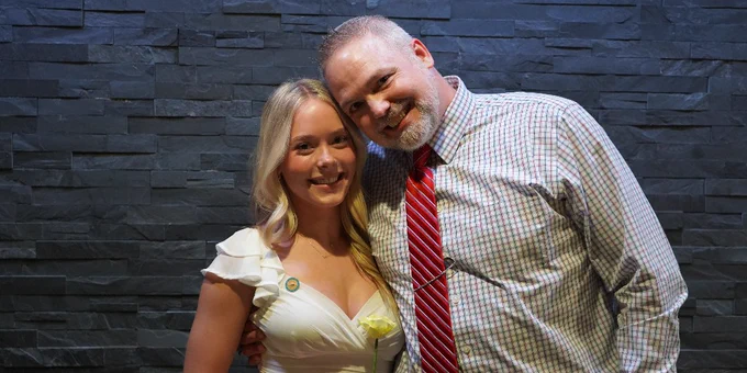 Two people posing for a photo.
