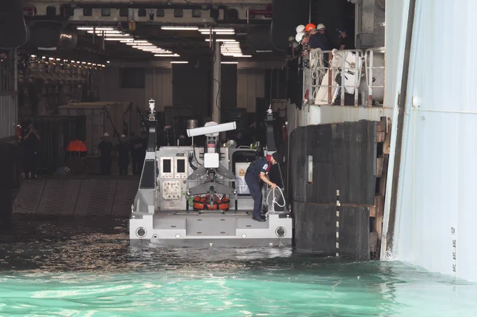 RNMB Ariadne docks inside RFA Lyme Bay