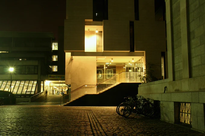 Exterior of the Long Room Hub at night.