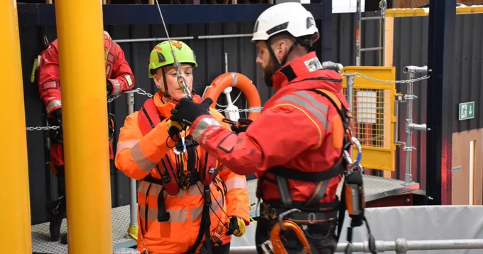 An instructor helping a participant.