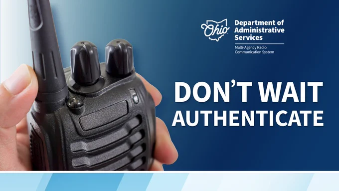 Close-up of a hand holding a black two-way radio with the DAS logo and 'Don't Wait Authenticate' message.