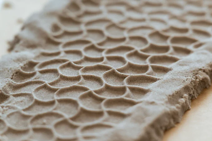 Piece of clay with bike marks. 