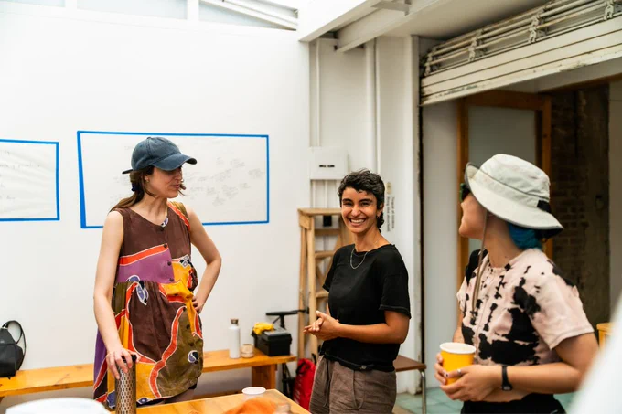 A group of people talking in a studio.