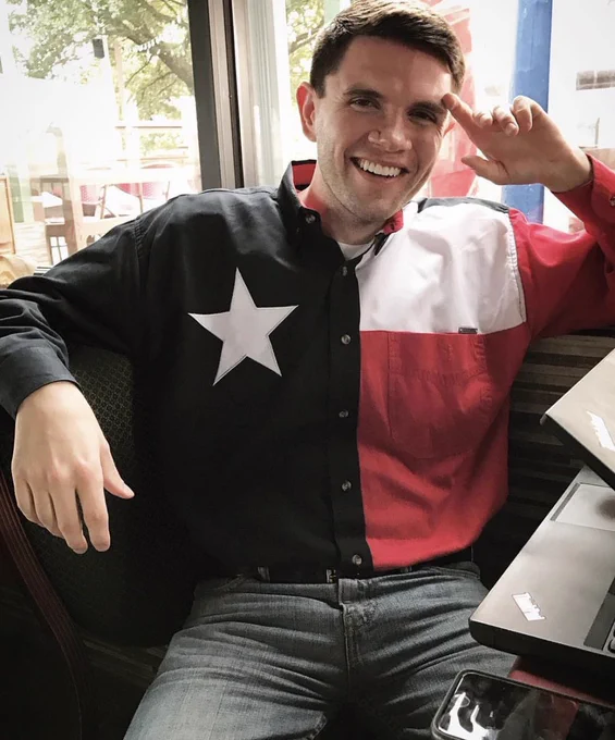 An image of a smiling James Talarico looking directly at the camera. He is wearing a Texas flag shirt. 