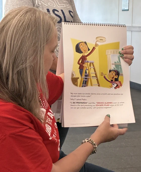 Woman reads to children in a library