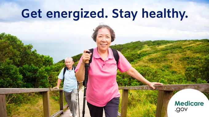 A photo of an older woman on a hike with her husband going up a set of stairs on a rolling green hill. Overlay text: Get energized. Stay healthy.