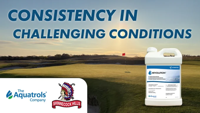 Shinnecock Hills Golf Club at sunset with a red flag in the hole on a putting green. Text reads "Consistency in Challenging Conditions." In the foreground, there is a large white jug labeled "Revolution" by Aquatrols. Logos for The Aquatrols Company and Shinnecock Hills are also visible.