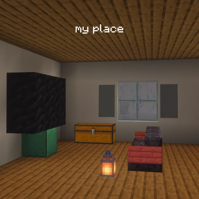 A sad little living room in Minecraft with the text "my place"