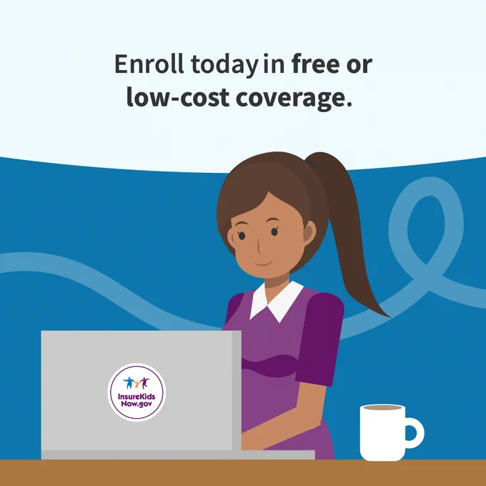 A person with brown hair is using a laptop with an "InsureKidsNow.gov" sticker. Text above reads: "Enroll today in free or low-cost coverage." A cup is on the desk beside the laptop.