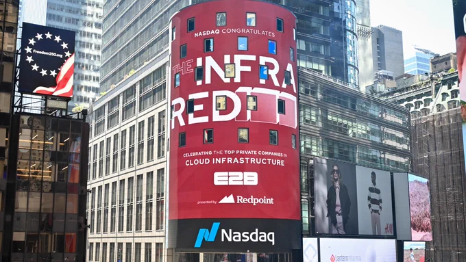 A large Times Square billboard celebrates E2B on the InfraRed 100 list, recognizing the top private companies in cloud infrastructure.