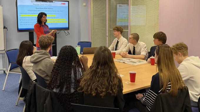 Woman talking to students