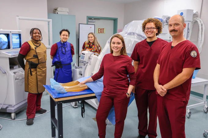 Radiography students posing for a photo inside the learning lab.