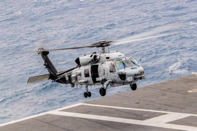 U.S. Navy sailors conduct flight operations while underway.