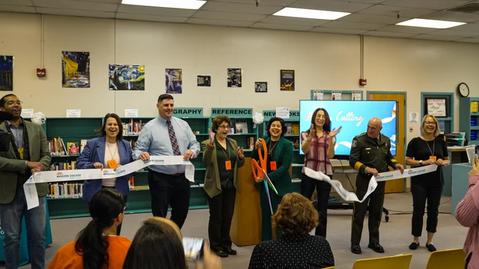 Ribbon cutting ceremony celebrating the new men's library at Elmwood.