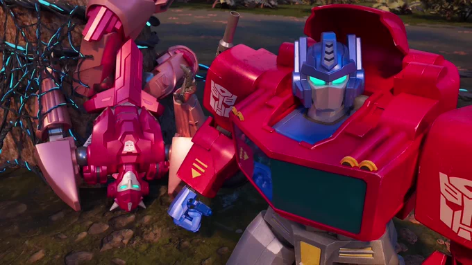 Elita-1 hangs upside down at the base of a tree, entangled in glowing cable, whilst Optimus Prime stands in front of her sternly looking at something behind camera.