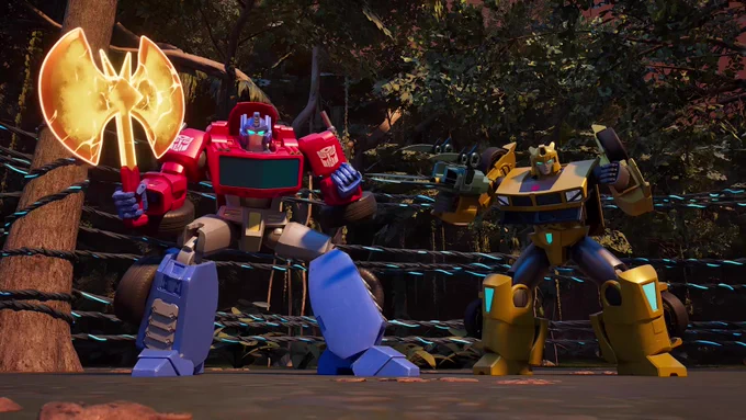 Optimus Prime and Bumblebee stand ready in front of some glowing cables wrapped around a tree in the middle of the Jungle Region. They are both brandishing their weapons (Optimus' axe and Bumblebee's bladed Stinger Pistol.)