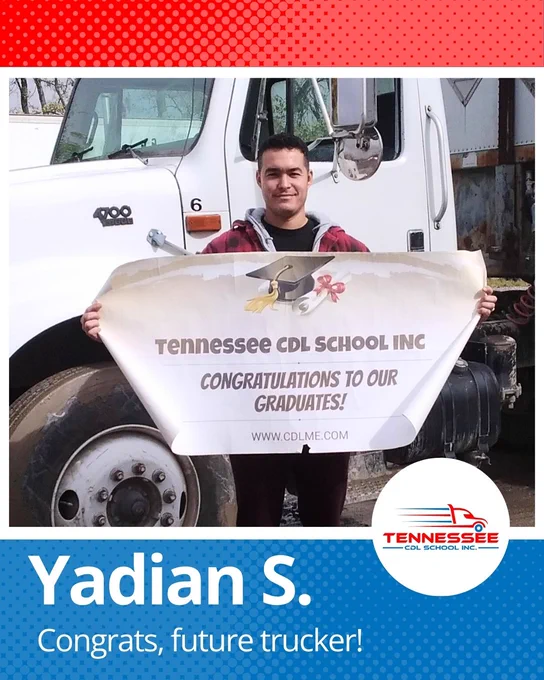 Person holding a Tennessee CDL School banner congratulating graduates, standing in front of a white truck.