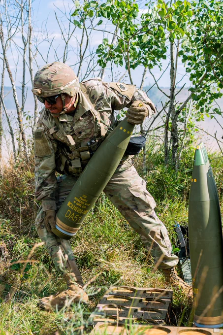 U.S. Army Spc. Frenando Rivas, a cannon crew member from the 1st Battalion, 160th Field Artillery Regiment, Oklahoma Army National Guard, carries a round during direct fire training with a M777A2 howitzer using 155mm rounds in conjunction with foreign national allies, providing artillery support during Exercise Northern Strike 24-2 at Camp Grayling, Michigan, on Aug. 7, 2024. Northern Strike 24-2, one of the Department of Defense's largest reserve component readiness exercises, is scheduled to take place at Michigan's National All Domain Warfighting Center (NADWC) from August 3-17, 2024. Over 6,300 participants from 32 states and territories and several international participants will converge at the NADWC. Northern Strike is the premier reserve component training event designed to build readiness with joint and partner forces in all domains of warfare. (U.S. Air National Guard photo by Staff Sgt. Wynndermere Shaw)\n\n