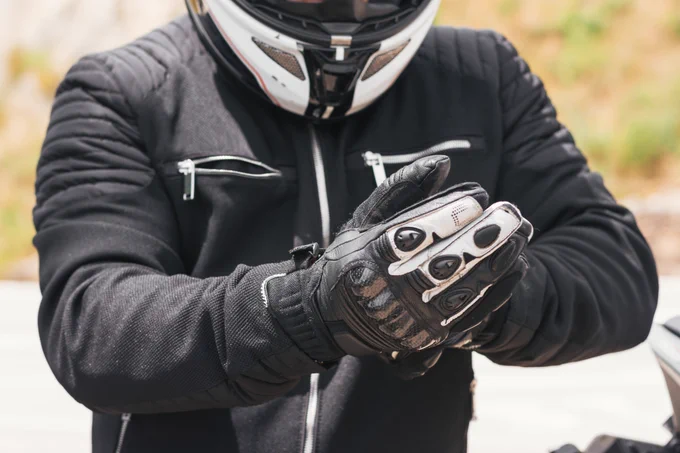 Man in motorcycle protective gear.
