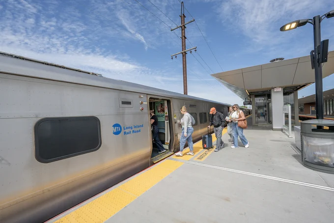 Riders boarding a train at Babylon Station.