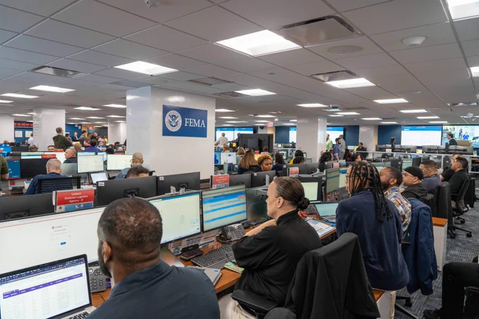 Interagency staff working at computers in the National Response Coordination Center at FEMA headquarters in Washington, DC.