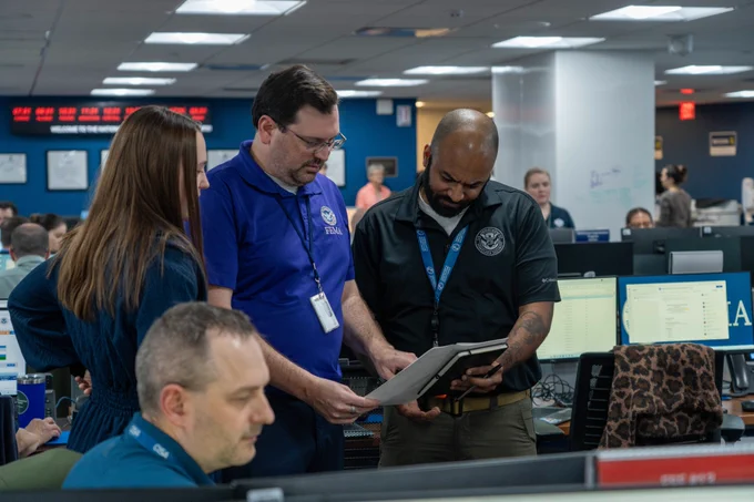 Interagency staff working at computers in the National Response Coordination Center at FEMA headquarters in Washington, DC.