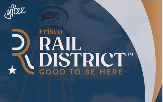 Alt text: Graphic promoting the Frisco Rail District with the words "Frisco Rail District - Good to Be Here" prominently displayed. A stylized "R" and a star accompany the text. The background features a water tower with "Frisco" written on it, set against a partly cloudy sky. The "Yiftee" logo appears in the top left corner.