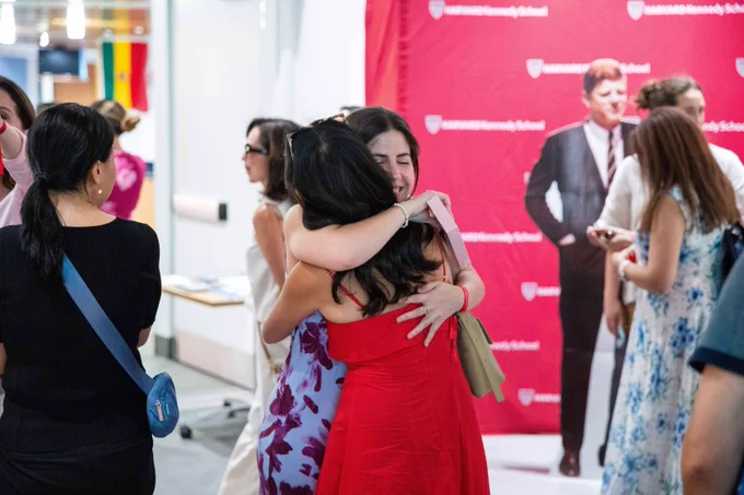 Two community members hugging.